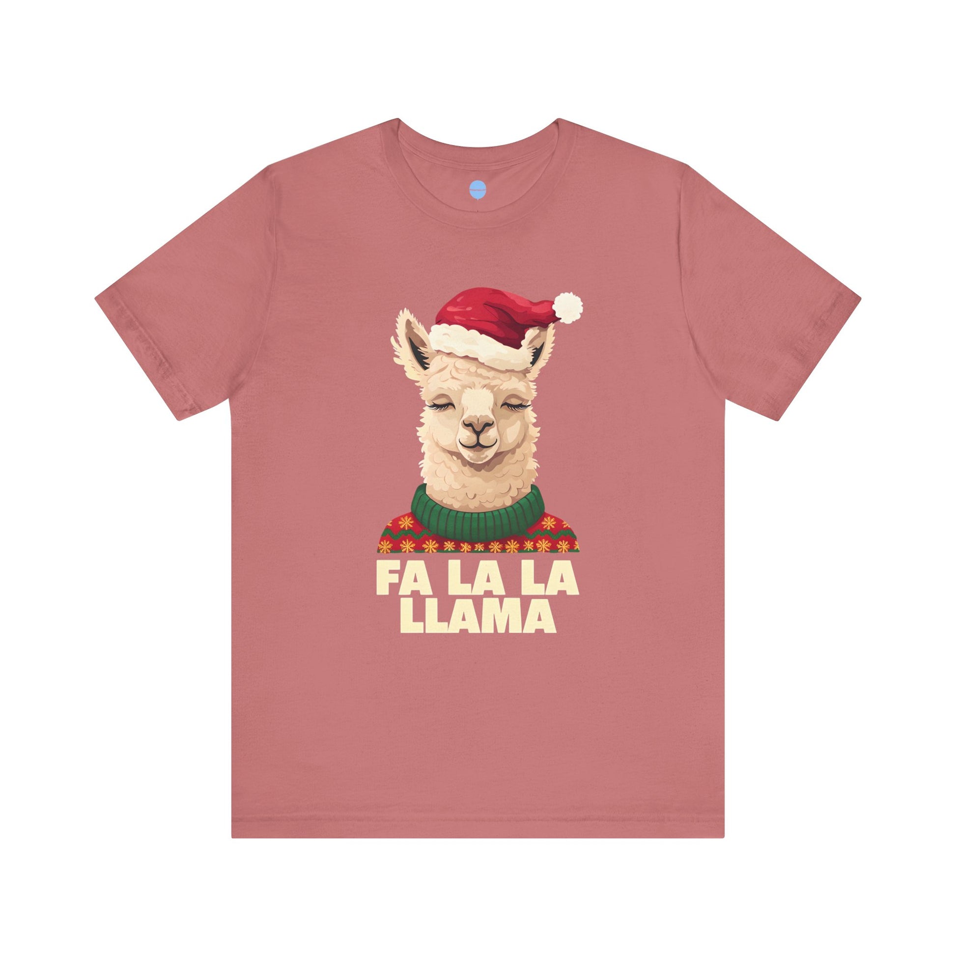 Pink t-shirt with a llama graphic wearing a Santa hat and sweater, and 'FA LA LA LLAMA' text on a white background.